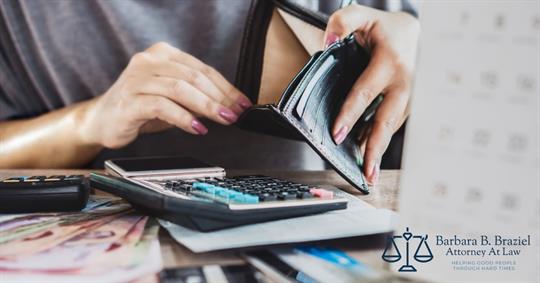 a person calculating his money