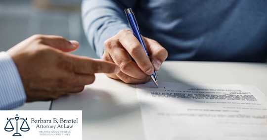 Person signing a contract